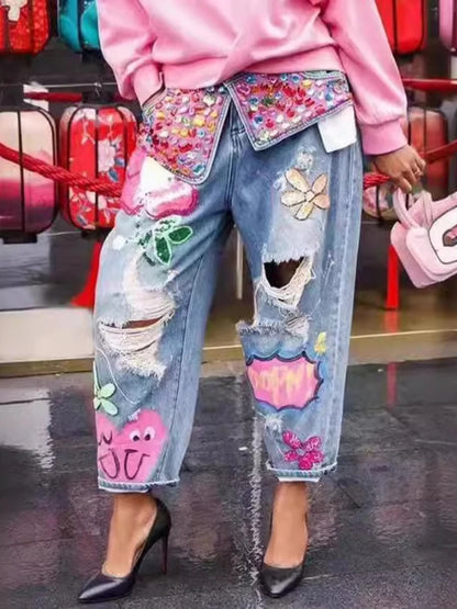 Coola jeansbyxor med broderier, pärlor, strass och slithål