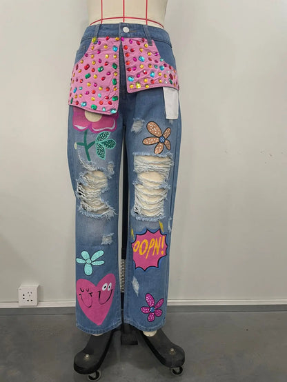 Coola jeansbyxor med broderier, pärlor, strass och slithål