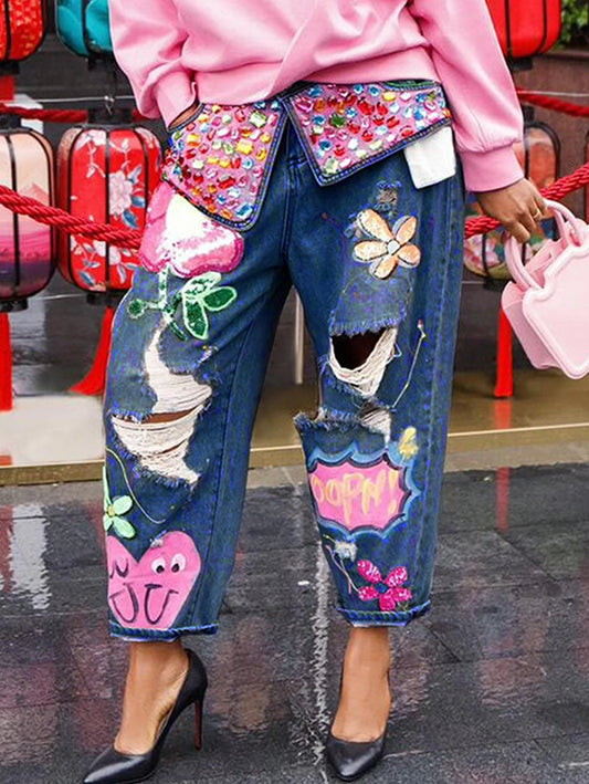 Coola jeansbyxor med broderier, pärlor, strass och slithål